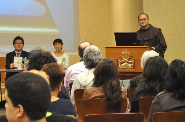Fr. Julian Jagodilla, director of the Migrant Center at the Church of St. Francis of Assisi, welcomes the crowd who attended the immigrant rights forum. Photo by NOEL T. PANGILINAN