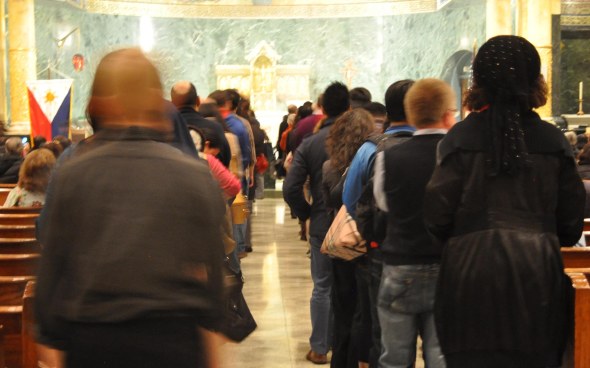 Filipino Americans in New York held a Memorial Mass for Typhoon Haiyan victims and survivors at the Church of St. Francis of Assisi in November.  Photo by NOEL T. PANGILINAN 