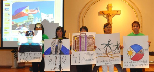 Members of the Damayan Migrant Workers Association  show the extent of the devastation brought by super typhoon Haiyan in numbers.   Photo by NOEL T. PANGILINAN 